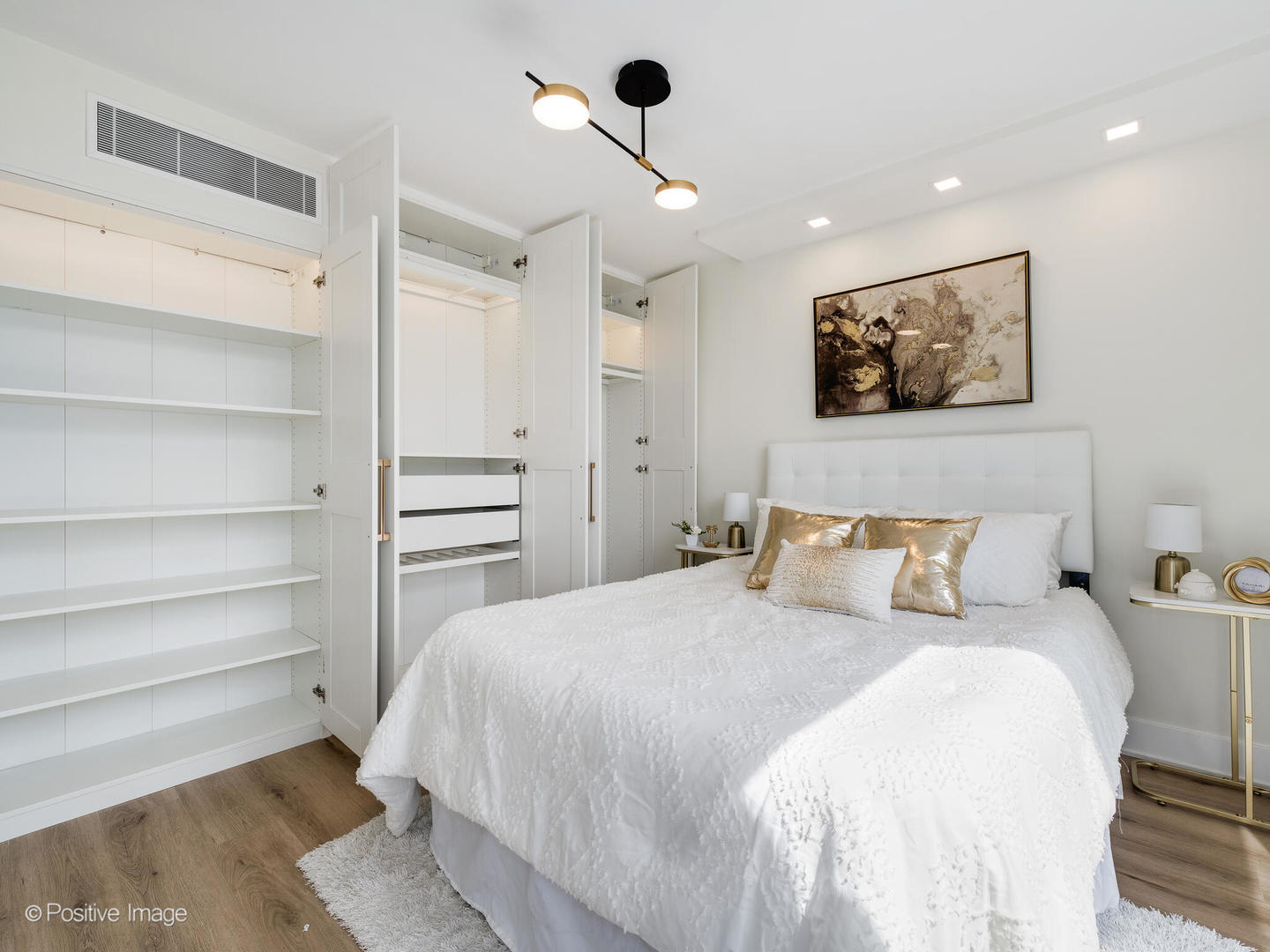 1310 North Ritchie Court, Unit 27B Chicago, IL 60610 - Photo 20 of 29 a bedroom with a bed and a painting on the wall