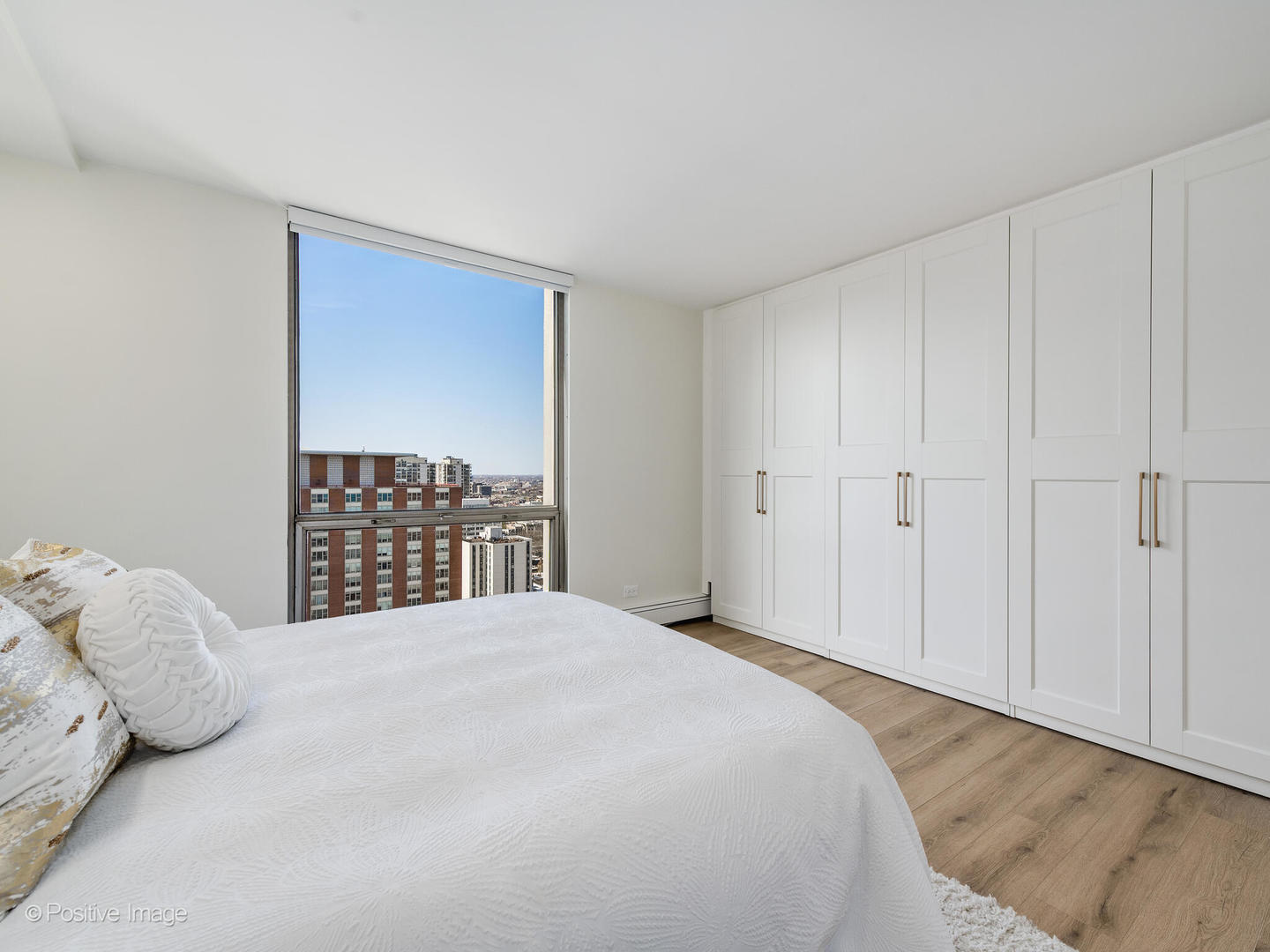 1310 North Ritchie Court, Unit 27B Chicago, IL 60610 - Photo 24 of 29 a bedroom with a bed and a closet