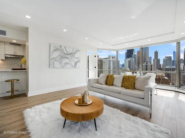 a living room with furniture and a rug