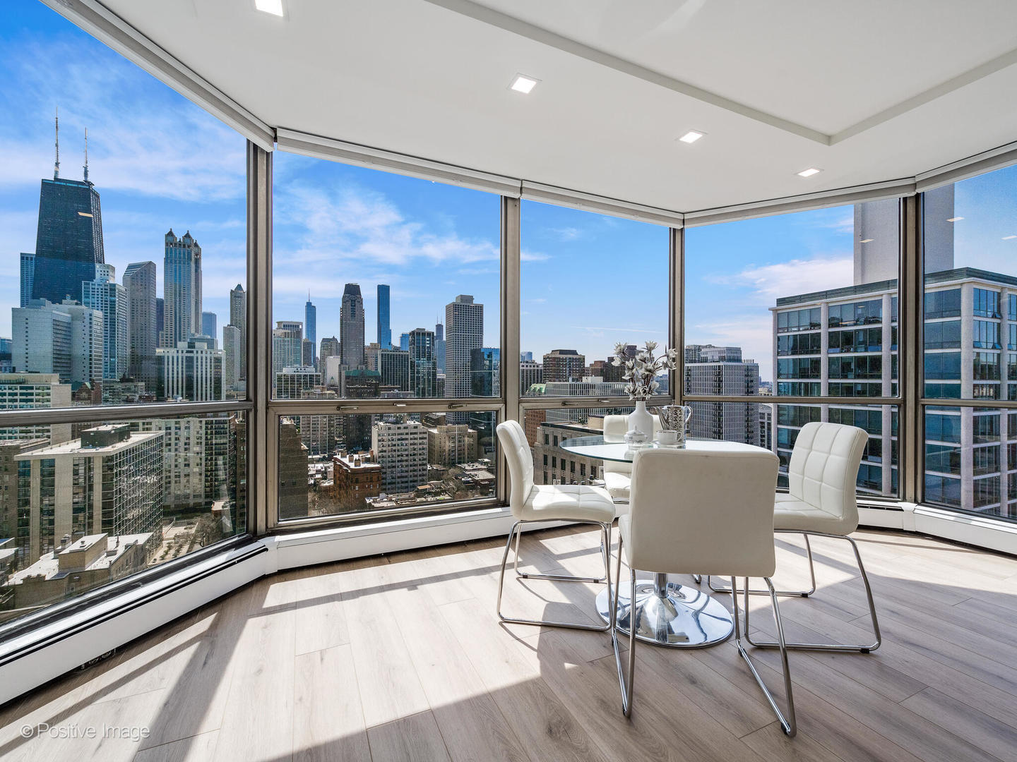 1310 North Ritchie Court, Unit 27B Chicago, IL 60610 - Photo 9 of 29 a dining room with furniture and wooden floor