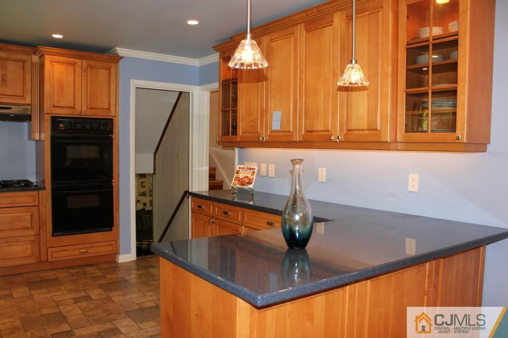 29 Huntington Road Edison, NJ 08820 - Photo 3 of 20 a kitchen with stainless steel appliances granite countertop a refrigerator and a sink