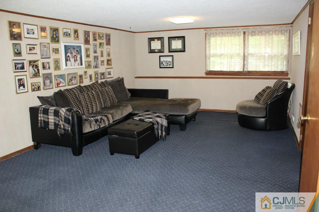 29 Huntington Road Edison, NJ 08820 - Photo 8 of 20 a living room with furniture and large window