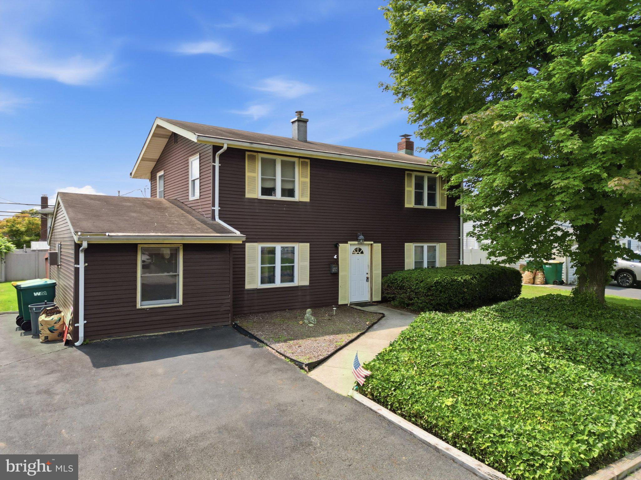 94 Terrace Road Levittown, PA 19056 - Photo 2 of 70 Charming two-story home with greenery.