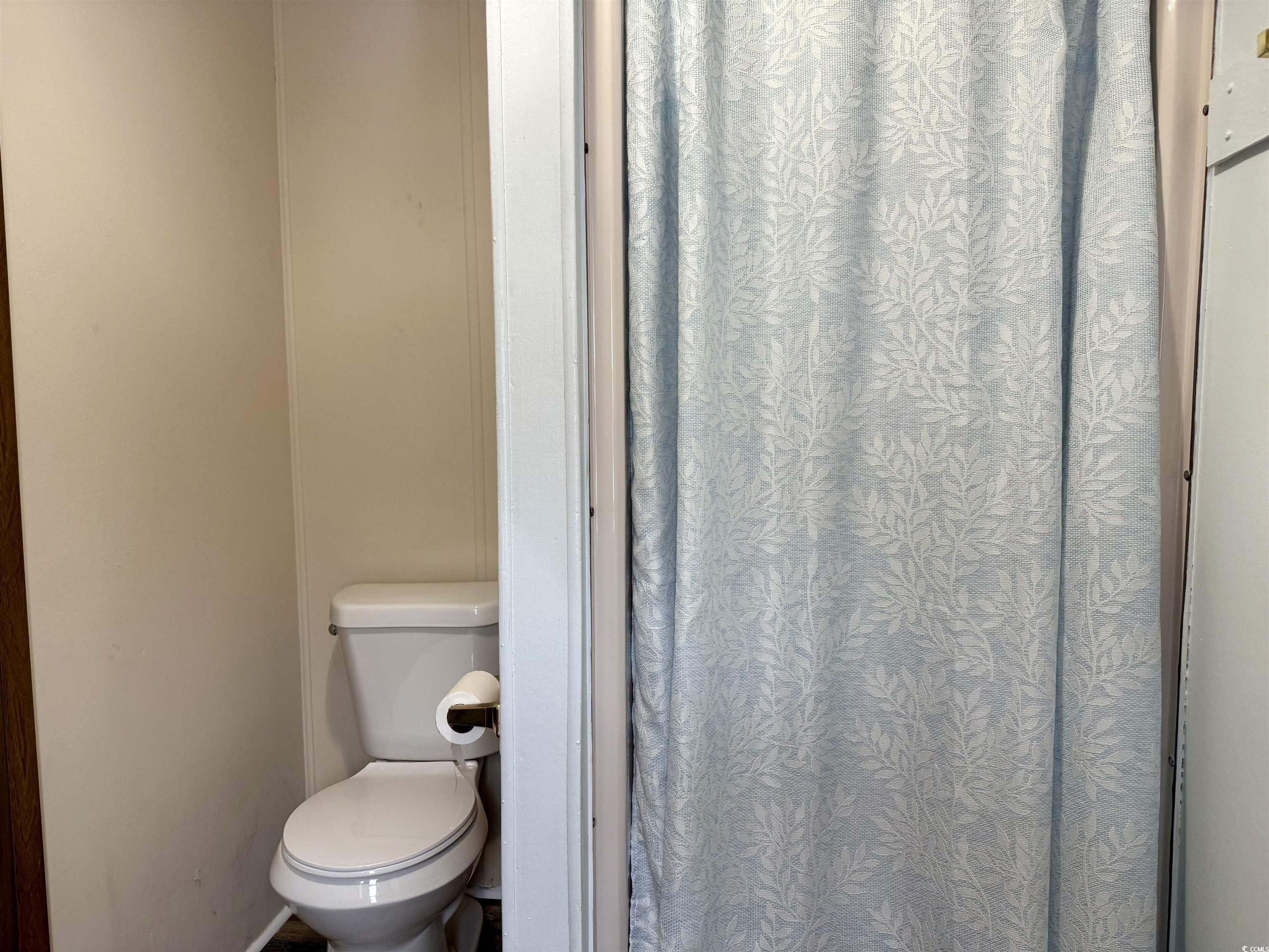1801 E Lake Surfside Beach, SC 29575 - Photo 14 of 32 Bathroom featuring curtained shower and toilet