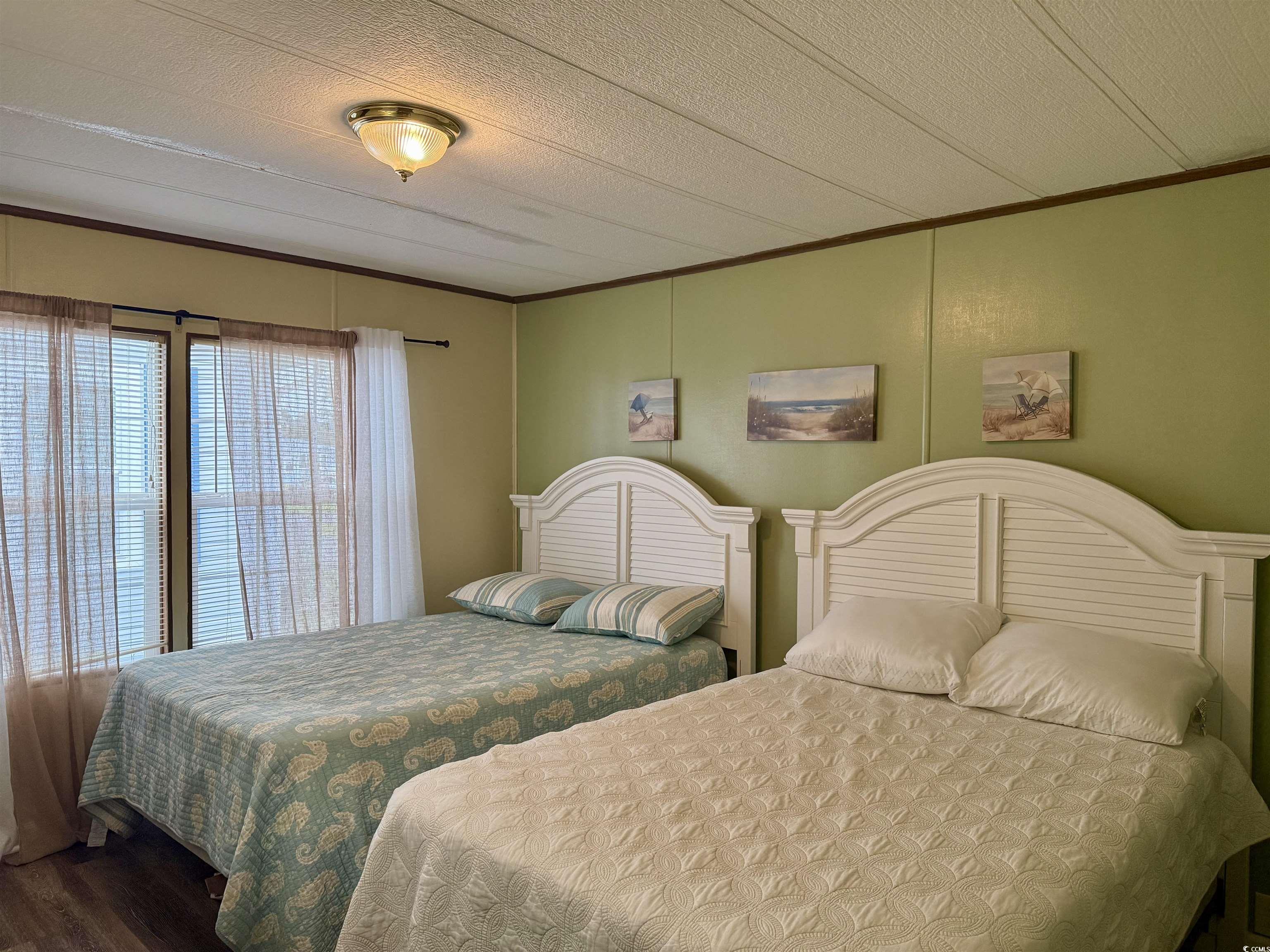 1801 E Lake Surfside Beach, SC 29575 - Photo 18 of 32 Bedroom with crown molding, a textured ceiling, and wood finished floors