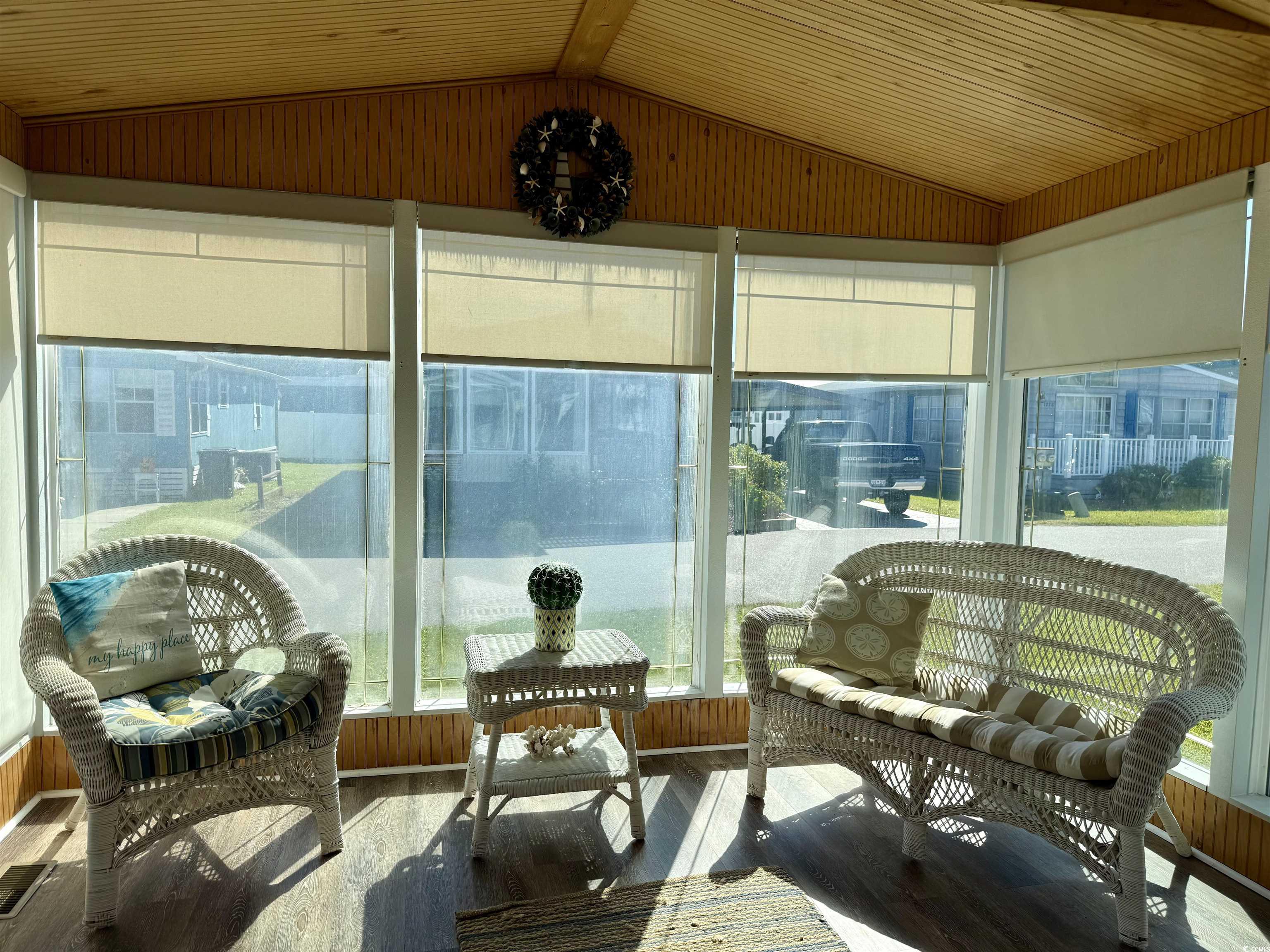1801 E Lake Surfside Beach, SC 29575 - Photo 20 of 32 Sunroom with lofted ceiling and wood finished floors