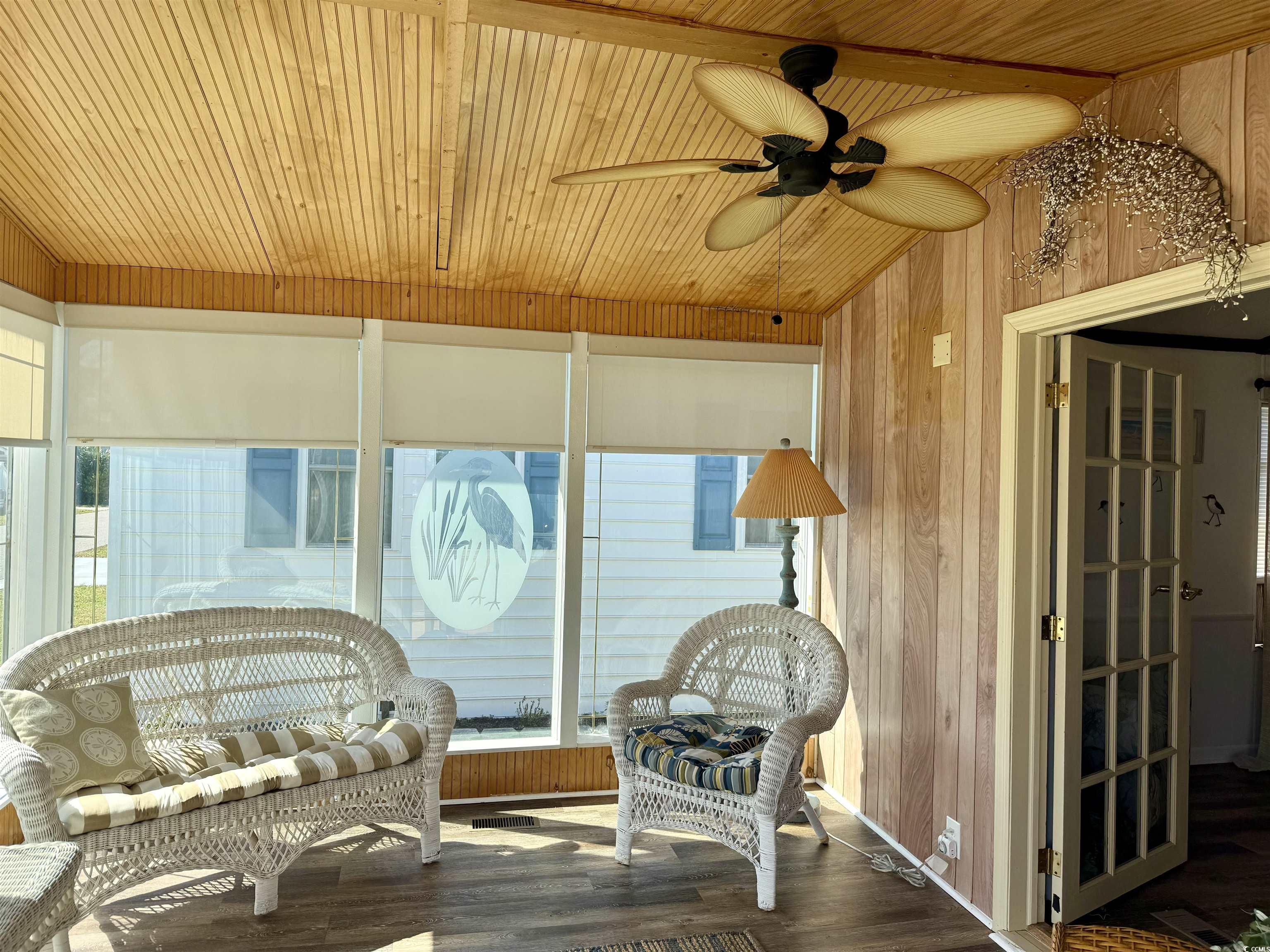 1801 E Lake Surfside Beach, SC 29575 - Photo 21 of 32 Sunroom / solarium with wood walls, wood finished floors, and wooden ceiling