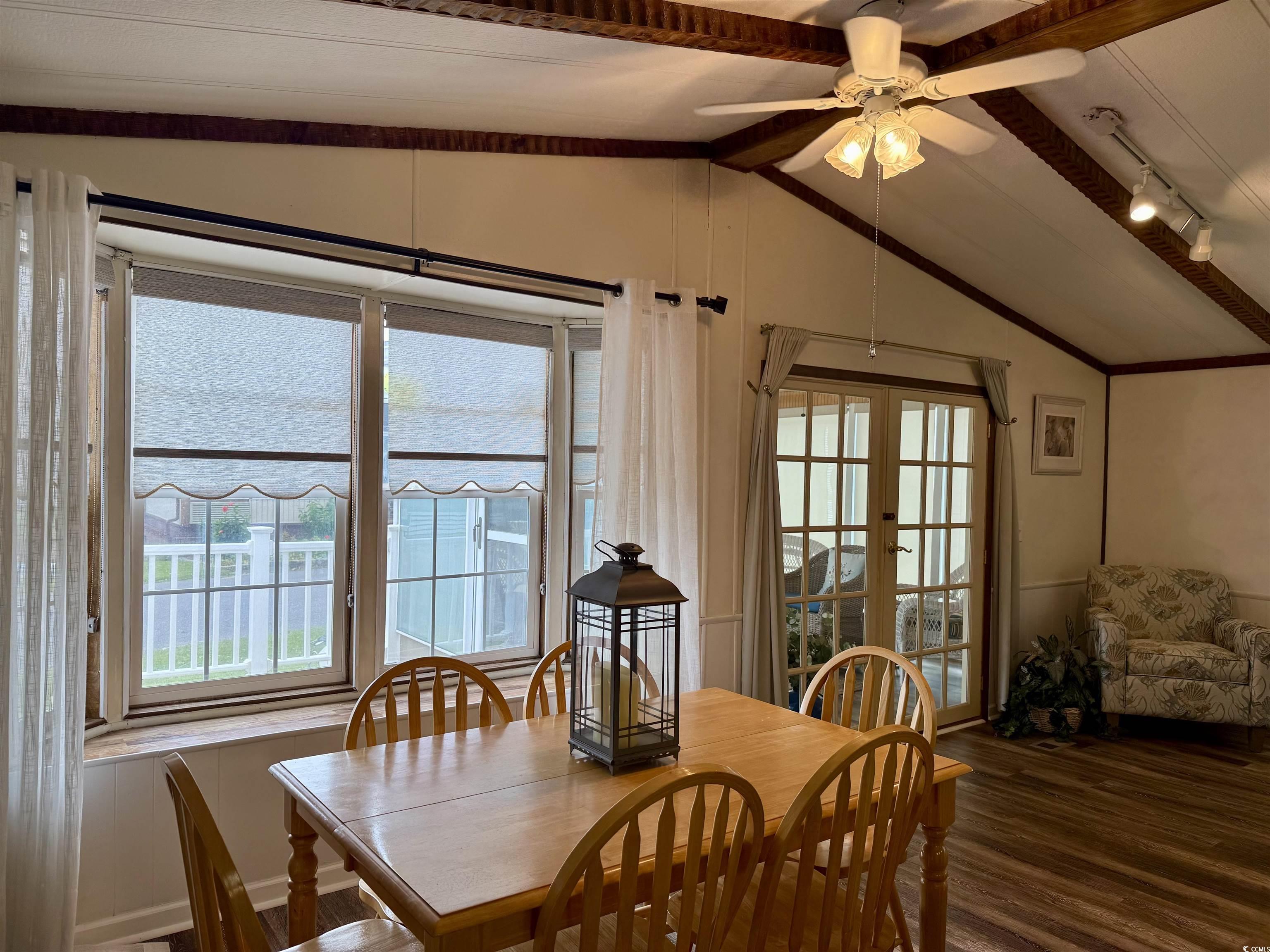 1801 E Lake Surfside Beach, SC 29575 - Photo 7 of 32 Dining room with french doors, dark wood finished floors, ceiling fan, and track lighting