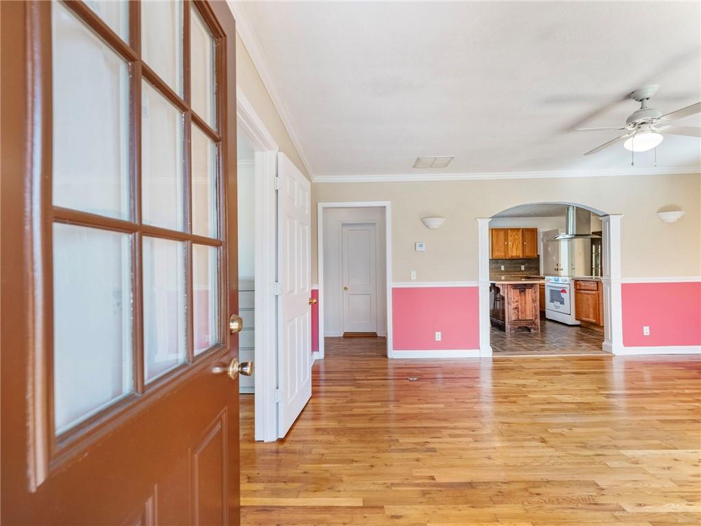 1686 Shoal Creek Road Monroe, GA 30656 - Photo 2 of 50 a hallway with wooden floor and furniture
