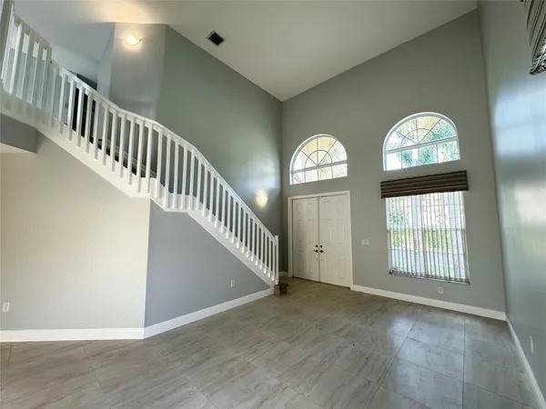 a view of an entryway with wooden floor