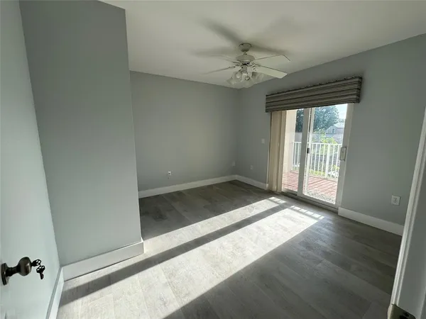 a view of an empty room and glass door