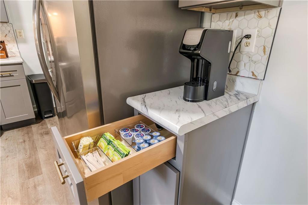 145 Mountain View Circle Covington, GA 30016 - Photo 2 of 6 a view of kitchen island with sink and refrigerator