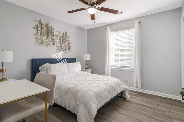 a bedroom with a bed and window