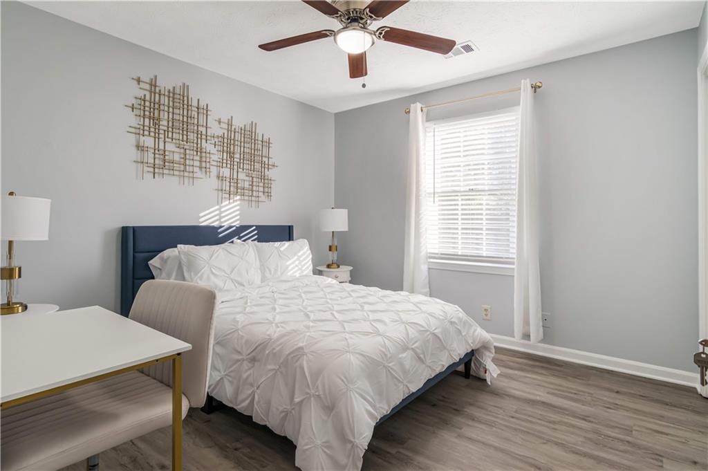 145 Mountain View Circle Covington, GA 30016 - Photo 6 of 6 a bedroom with a bed and window