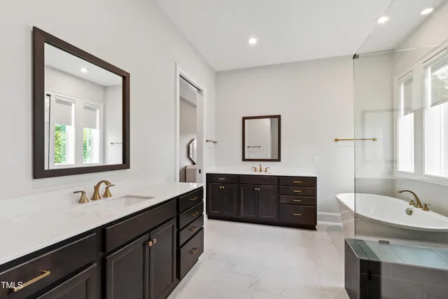 a kitchen with stainless steel appliances a refrigerator and wooden floor
