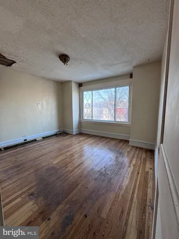 a bathroom with a tub a sink and a large mirror