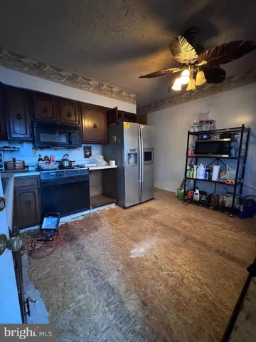 a room with furniture a flat screen tv and a book shelf