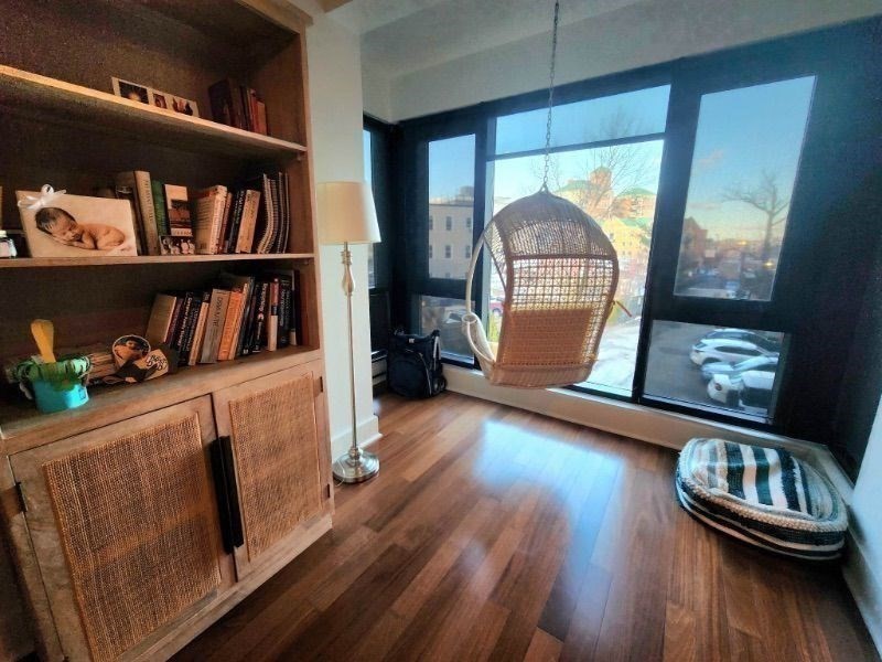 533 Cambridge Street, Unit 105 Boston, MA 02134 - Photo 15 of 32 a view of livingroom with furniture and wooden floor