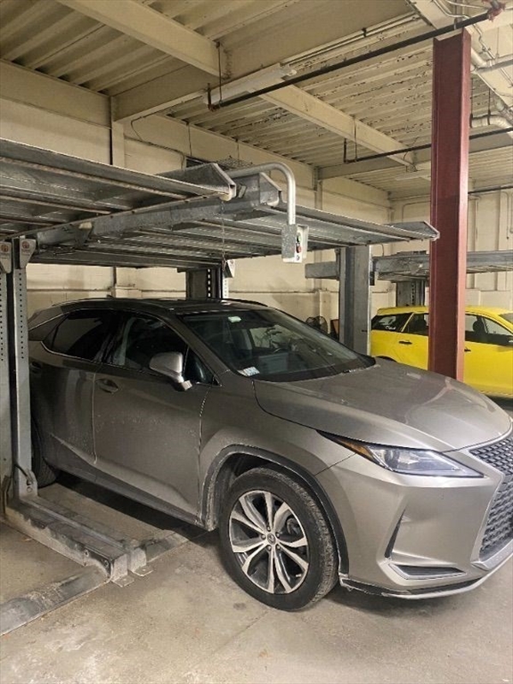 533 Cambridge Street, Unit 105 Boston, MA 02134 - Photo 31 of 32 a car parked in a garage