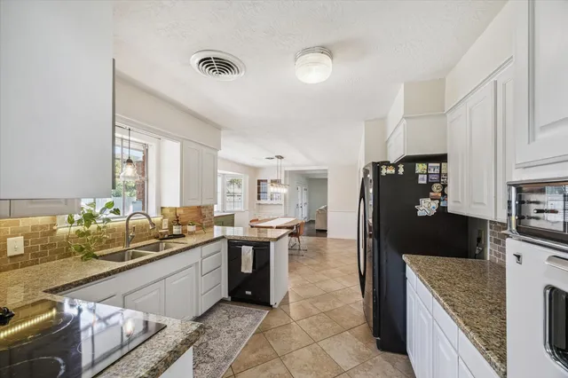 a spacious bedroom with a bed and a window