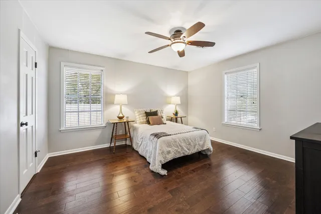 a bathroom with a shower sink and mirror