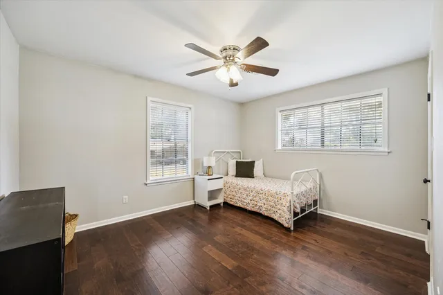 a bedroom with bed and a window