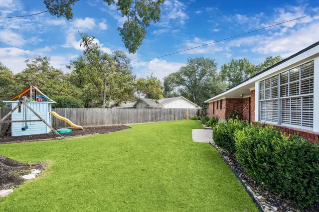 a view of backyard with green space