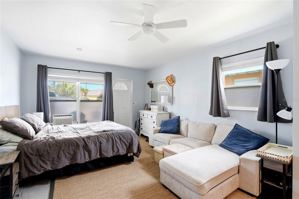 2311 Bay Boulevard Indian Rocks Beach, FL 33785 - Photo 15 of 80 a bedroom with a bed and wooden floor
