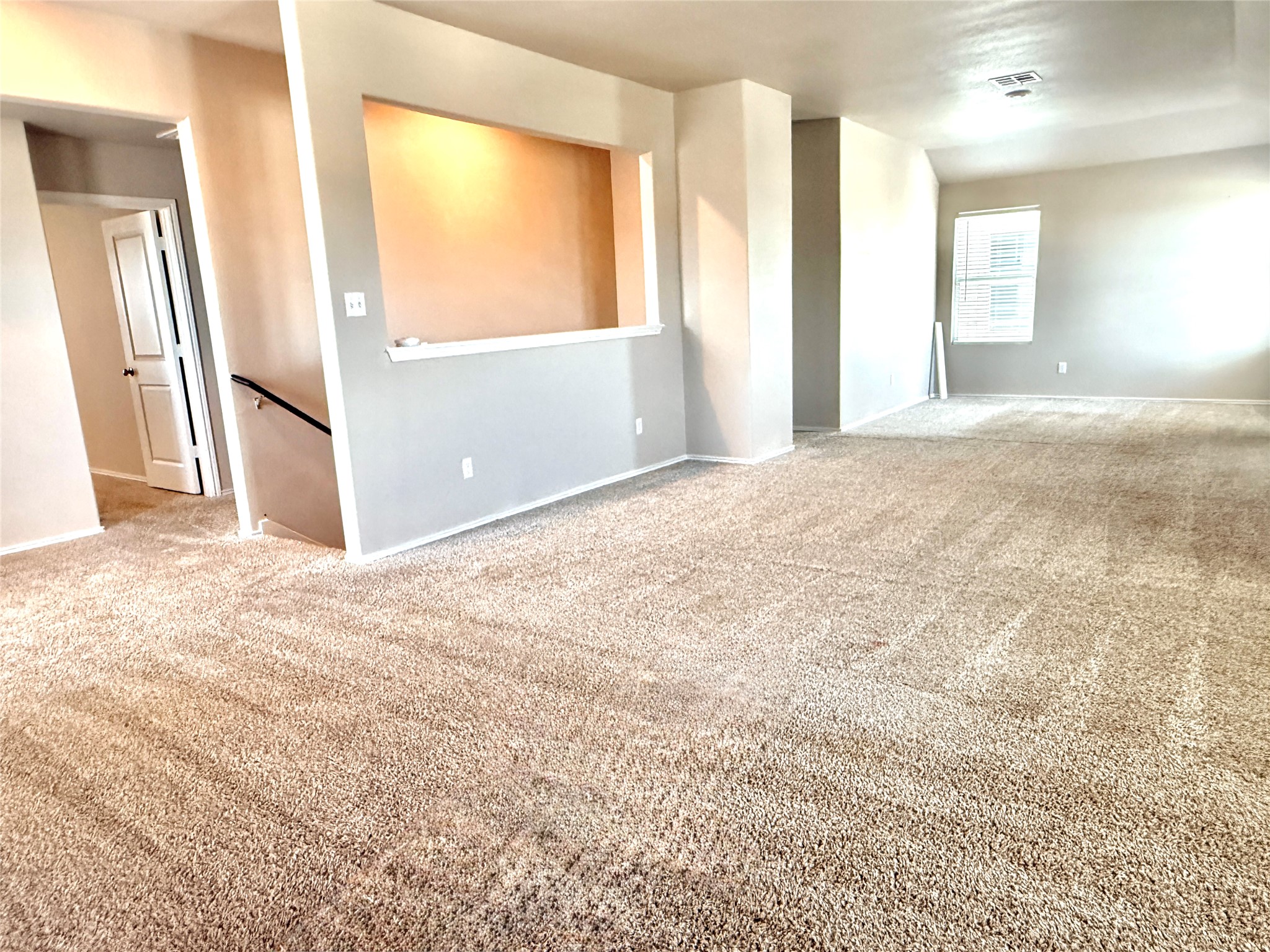 129 Perfect World Loop Jarrell, TX 76537 - Photo 20 of 31 A spacious common area with plush carpeting awaits your personal touch.