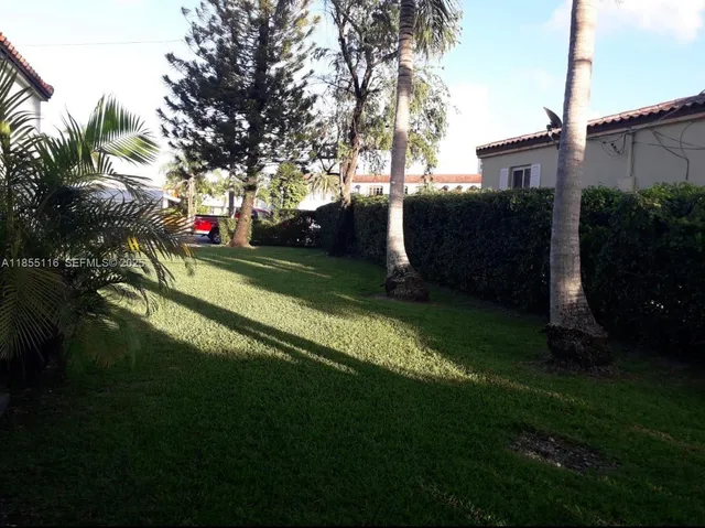 a view of backyard with green space