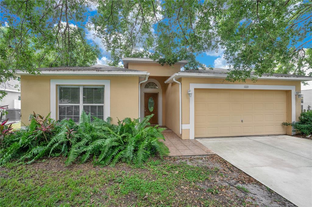 1221 Welch Ridge Terrace Apopka, FL 32712 - Photo 1 of 1 front view of a house with a yard