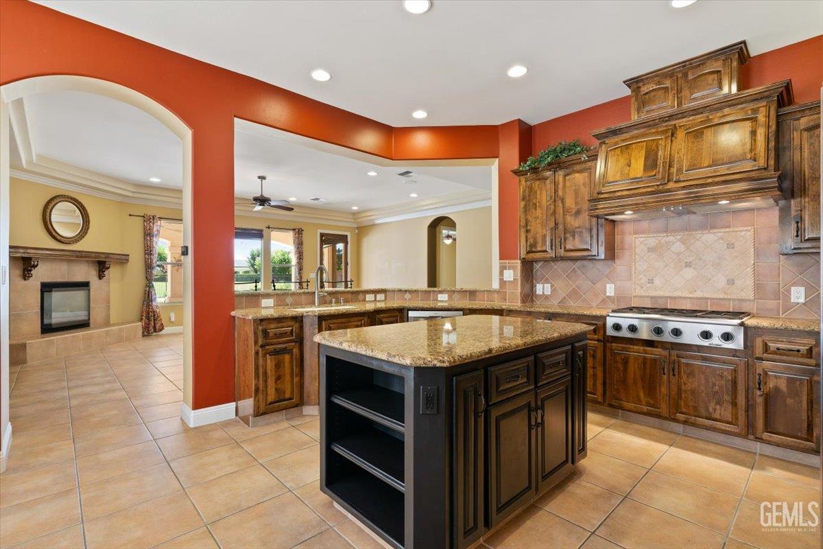 Undisclosed Address Bakersfield, CA 93311 - Photo 12 of 41 a kitchen with stainless steel appliances granite countertop a stove and a sink