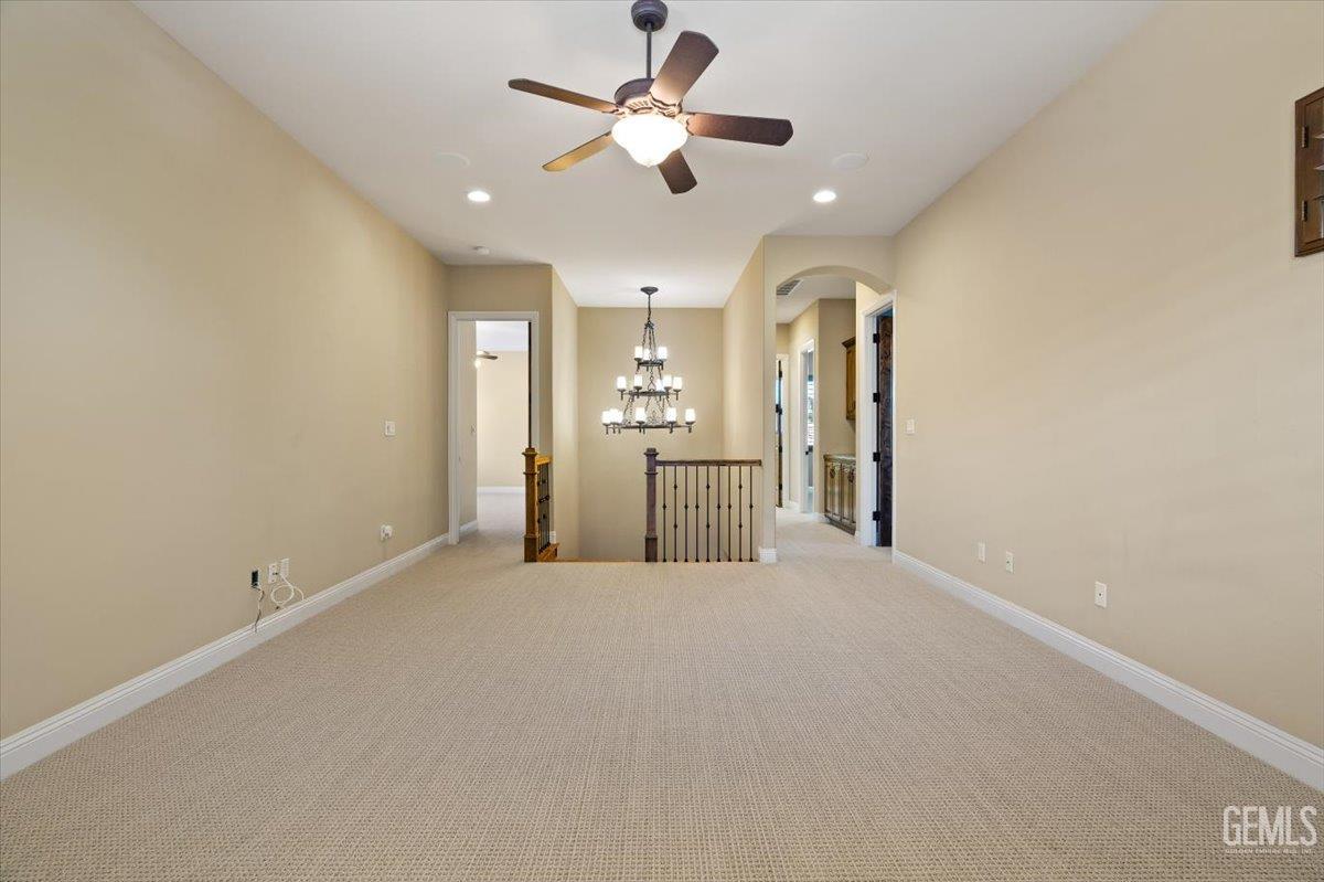 Undisclosed Address Bakersfield, CA 93311 - Photo 15 of 41 a view of a kitchen with a sink and a refrigerator