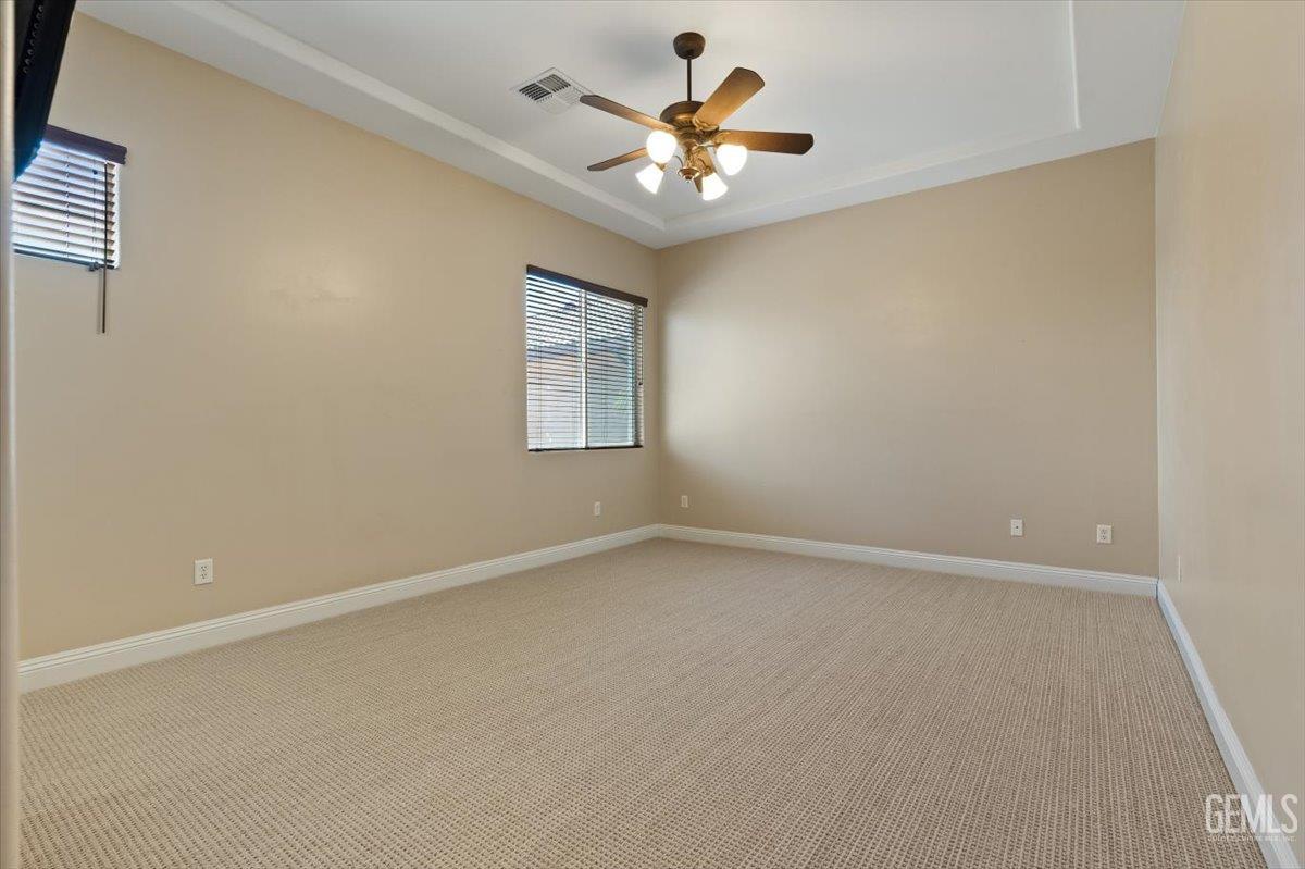 Undisclosed Address Bakersfield, CA 93311 - Photo 16 of 41 an empty room with windows and fan