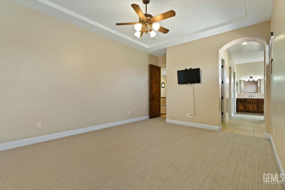 Undisclosed Address Bakersfield, CA 93311 - Photo 17 of 41 an empty room with a empty space and a ceiling fan