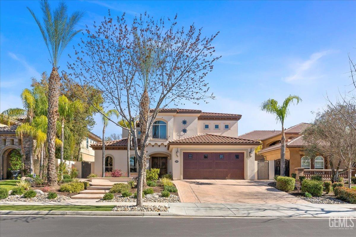 Undisclosed Address Bakersfield, CA 93311 - Photo 2 of 41 a front view of a house with a tree