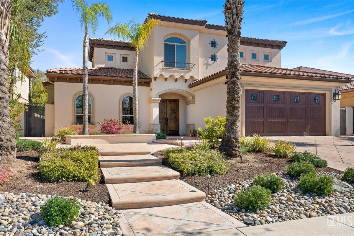 Undisclosed Address Bakersfield, CA 93311 - Photo 3 of 41 a front view of a house with garden