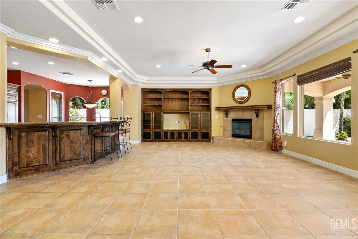 Undisclosed Address Bakersfield, CA 93311 - Photo 7 of 41 a large living room with a fireplace furniture and a large window