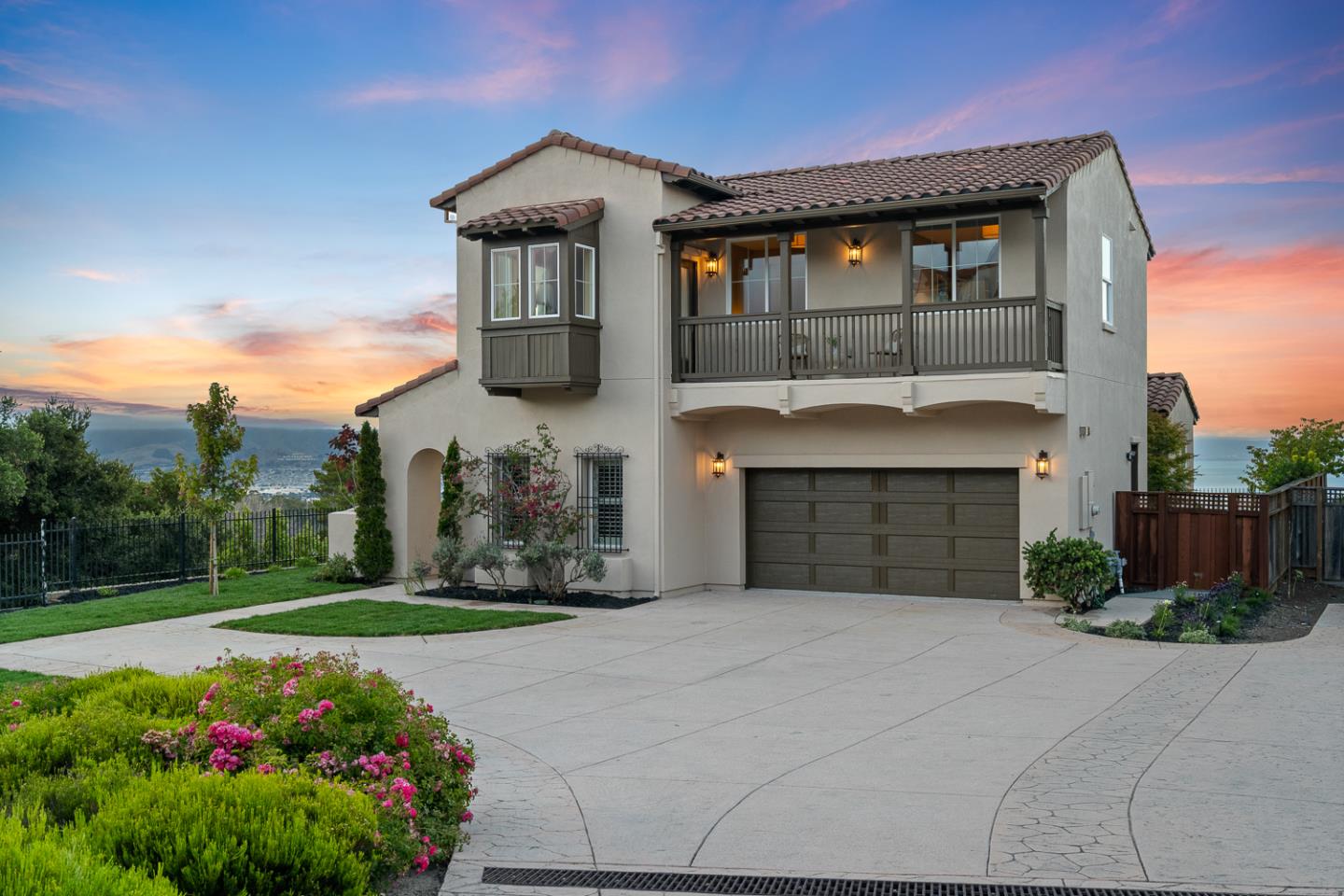 a front view of a house with a garden