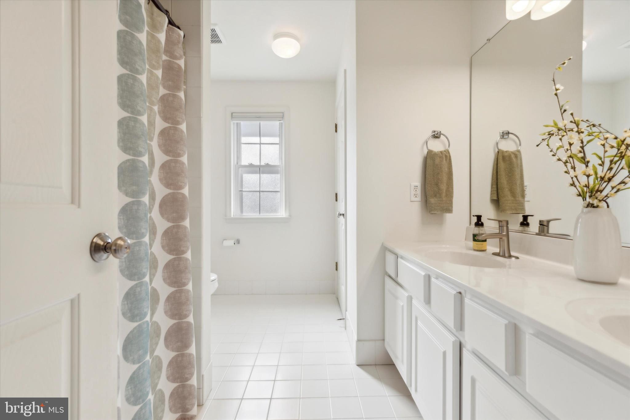 4 Waters Road Malvern, PA 19355 - Photo 18 of 26 Tiled Primary Bath with shower and dual vanity