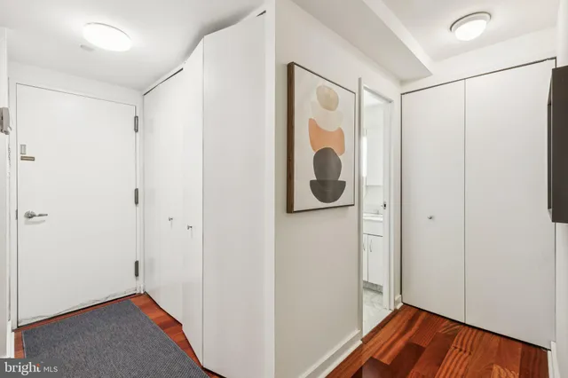 a view of a storage & utility room with a refrigerator