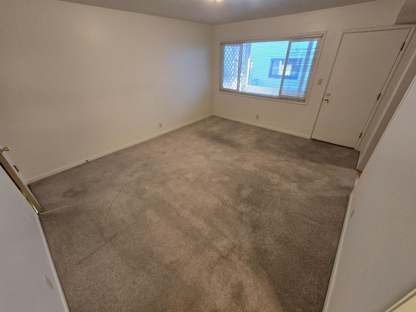 801 Fairfield Road, Unit 6 Burlingame, CA 94010 - Photo 10 of 16 an empty room with windows