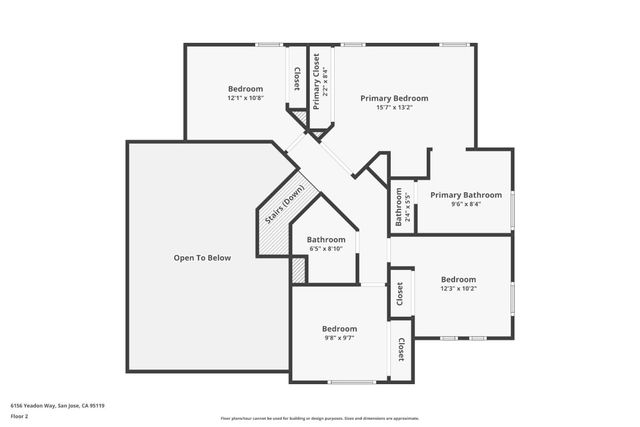 a front view of a house with a garden and trees