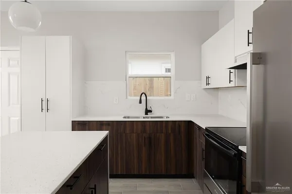 a kitchen with a sink and cabinets