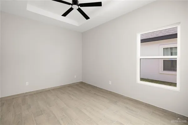 a view of a room with a air conditioner and white walls