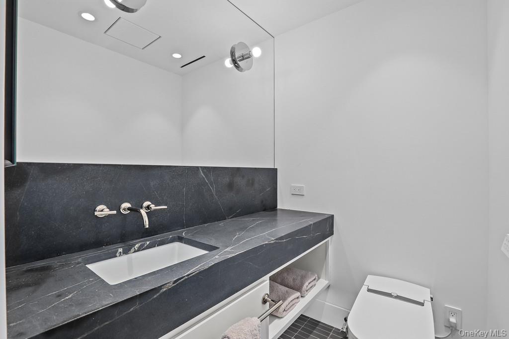 56 Northrup Road Dover Plains, NY 12522 - Photo 27 of 46 a bathroom with a sink and a toilet