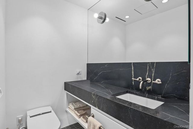 a bathroom with a sink and a toilet