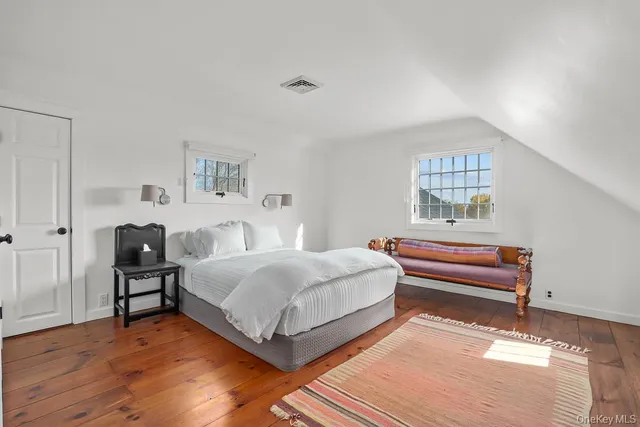 a bedroom with a bed and a table in it