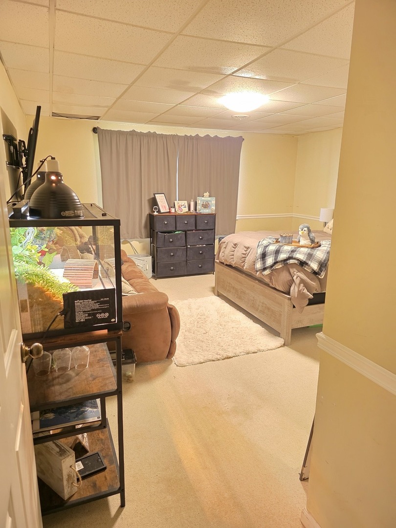 107 Comanche Trail Loda, IL 60948 - Photo 25 of 37 a living room with a couch and a stove next to a window