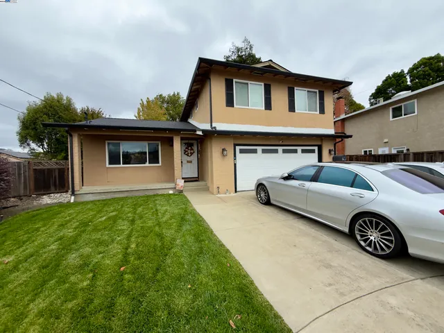 a front view of a house with garage